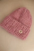 Women's winter hat made of fluffy knit with an elegant button dark pink
