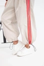 Women's cotton set with oversize trousers and contrasting stripes beige