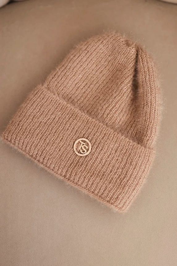 Women's winter fluffy hat with a decorative button light camel