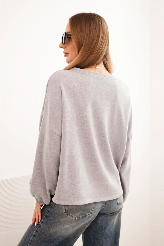 Women's sweatshirt with decorative finish at the bottom gray