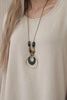 Oversized blouse with pendant dark beige