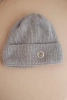 Women's winter fluffy hat with decorative button dark gray
