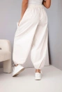 Women's cotton trousers with elastic waistband and tie fastening at the bottom beige