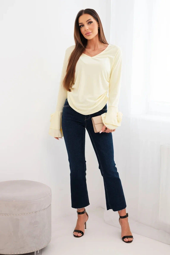 Women's ribbed blouse with a V-neck and frills on the sleeves yellow