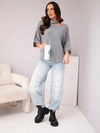 A sweater women's oversize with asymmetric neckline and turtleneck gray