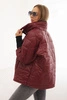 Quilted women's jacket with a short cut and a stand-up collar burgundy