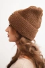 Women's winter fluffy hat with decorative button light brown