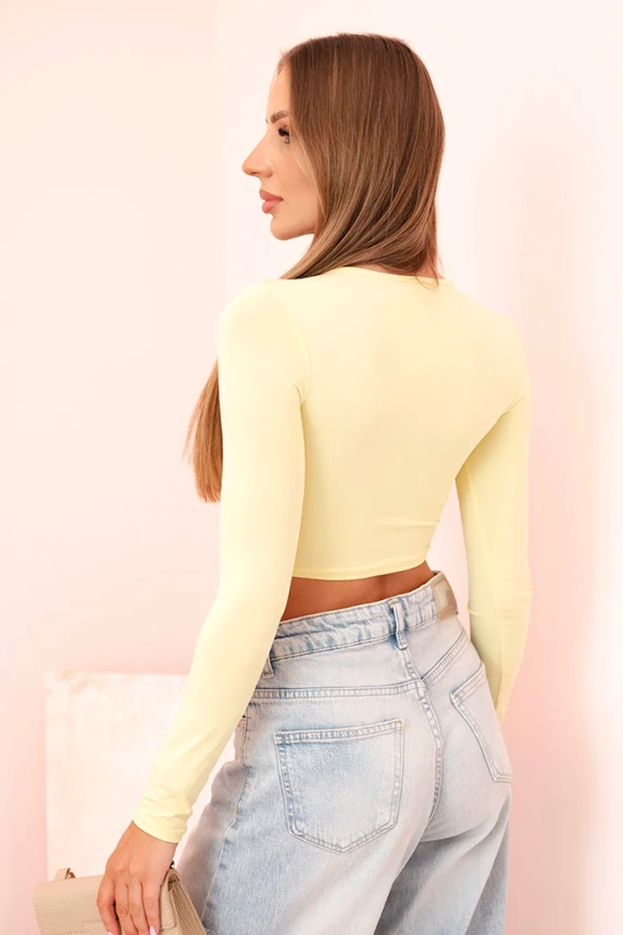 Women's blouse with long sleeves and effective ruffles on the bust yellow