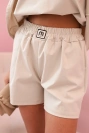 Damen-Set mit Rüschen – eine kurzärmelige Bluse und Shorts mit Gummizug beige