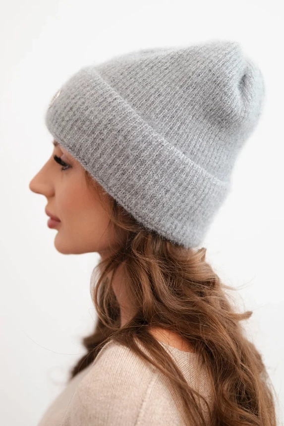 Women's winter fluffy hat with decorative button gray