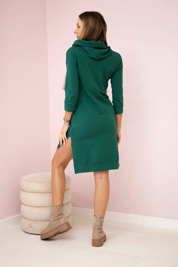 Dress with longer back and colorful print dark green