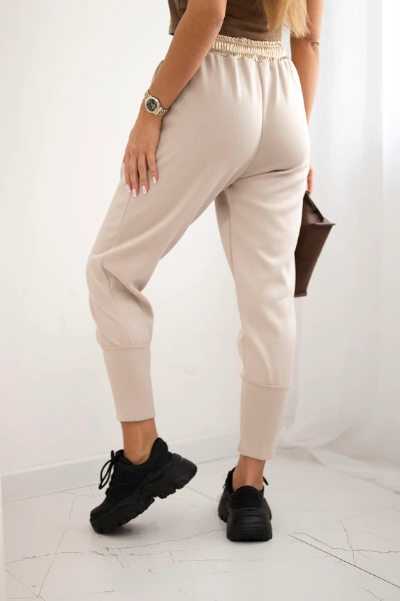 Butter-soft pants with a golden waistband cuff beige