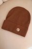 Women's ribbed cap made of modal and viscose with a decorative button light brown