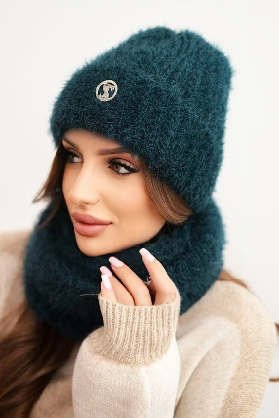 Women's set hat and fluffy winter snood with decorative emblem sea color
