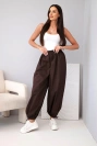 Women’s cotton pants with an elastic waistband and tie at the bottom brown