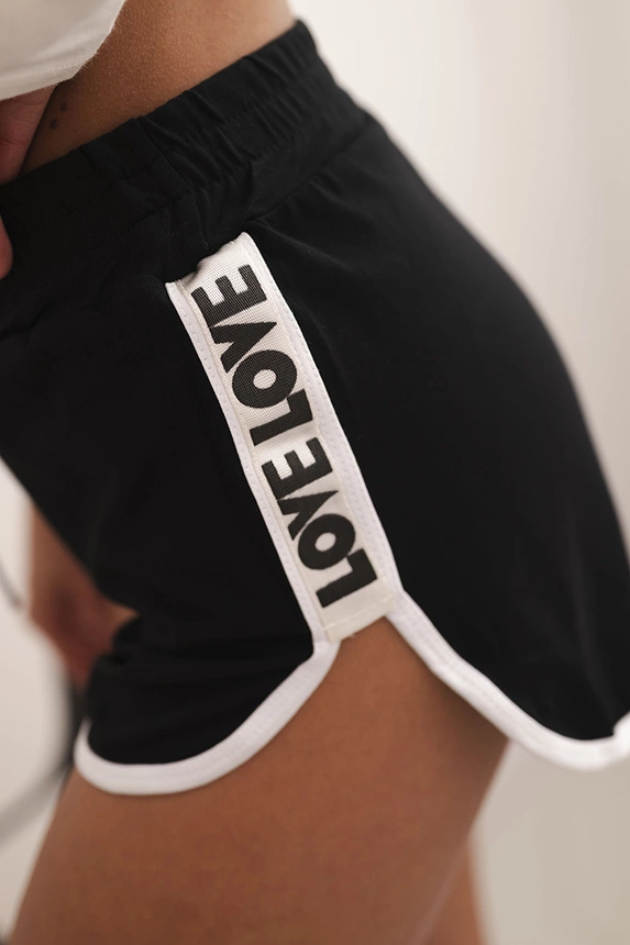 Women's cotton shorts with an elastic waistband and sporty piping black