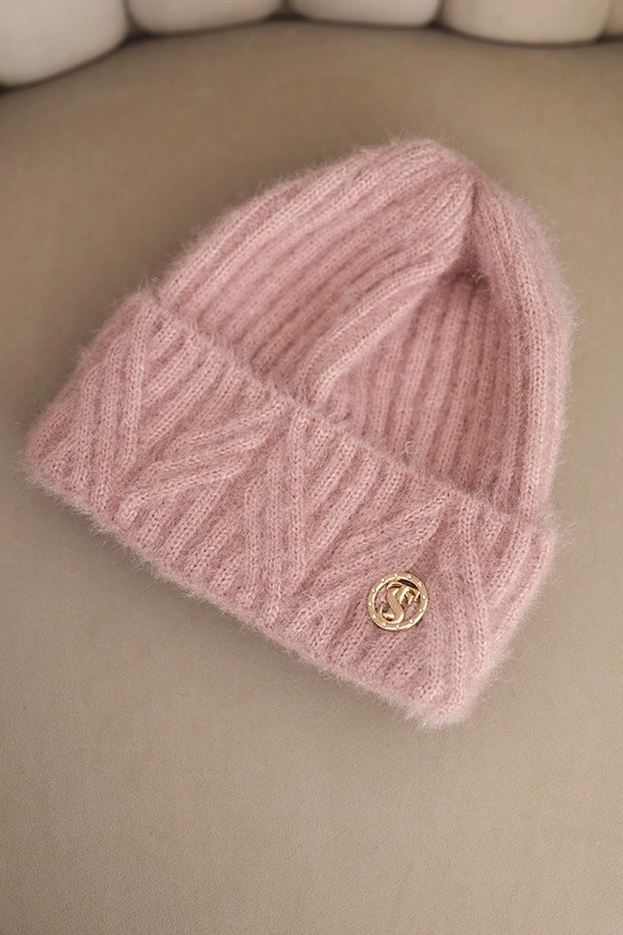 Women's winter hat made of fluffy knit with an elegant button powder pink