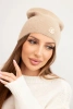 Classic women's cap made of soft knit with a decorative plate beige
