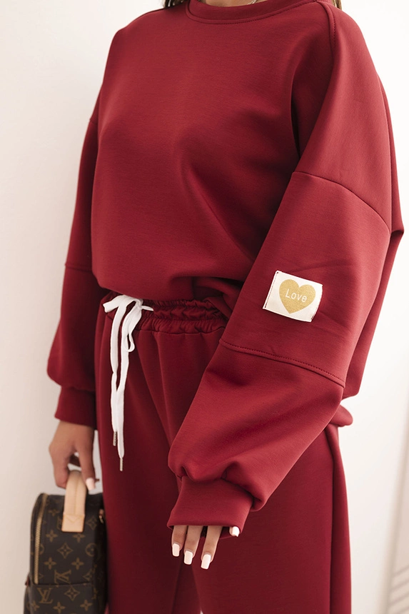 Damen-Set aus lockerem Hoodie und Hose mit dem Schriftzug LOVE bordeaux