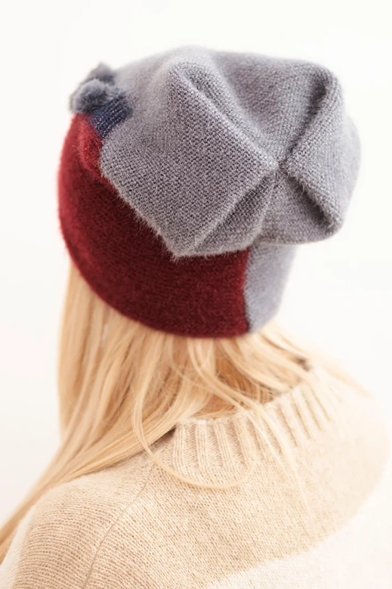 Women's elegant cap with fur decorations and a glittery band gray