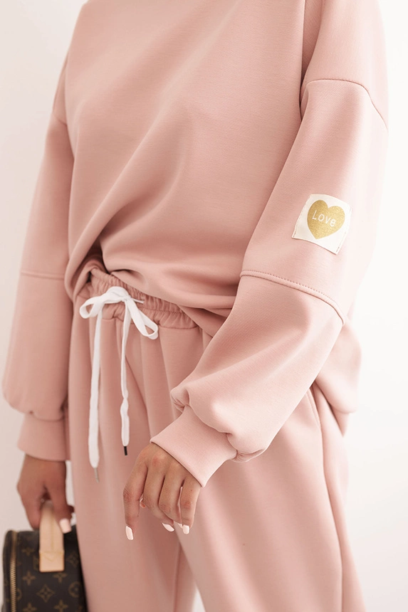 Women's set with a loose sweatshirt and pants with the word LOVE dark powder pink
