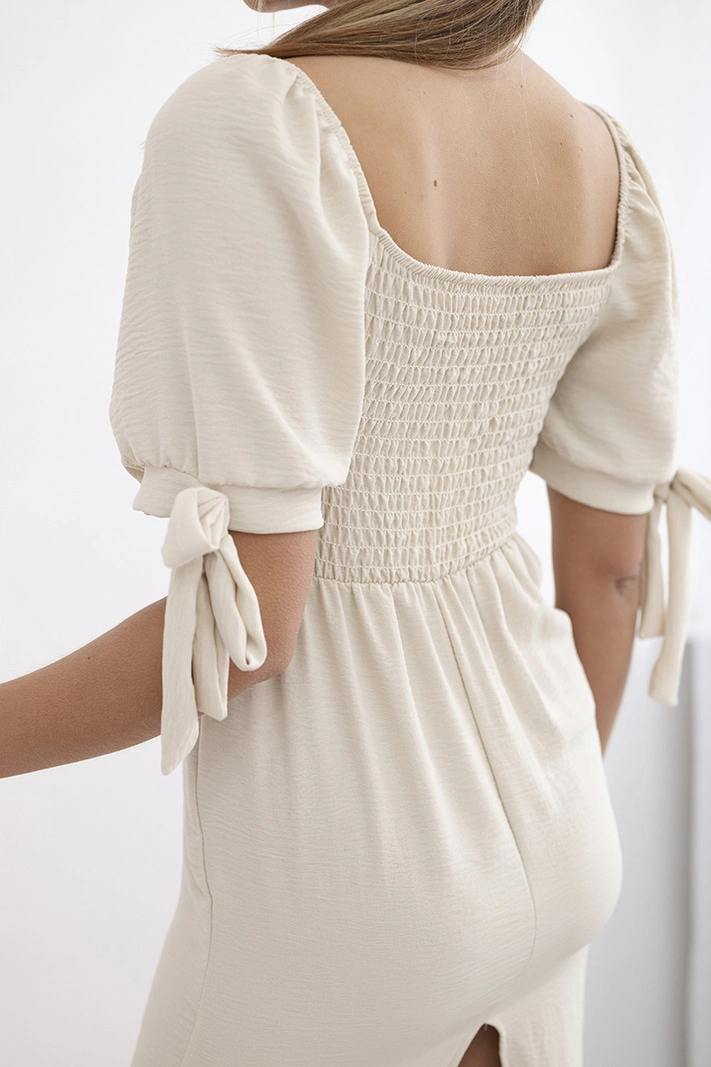 Dress ruffled at the back with tied sleeves beige