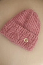 Women's winter hat made of fluffy knit with an elegant button dark pink