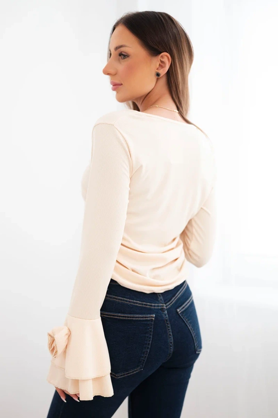 Women's ribbed blouse with a V-neck and ruffles on the sleeves beige