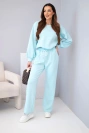 Komplet damski masełko bluza z broszką i spodnie z prostą nogawką błękitny