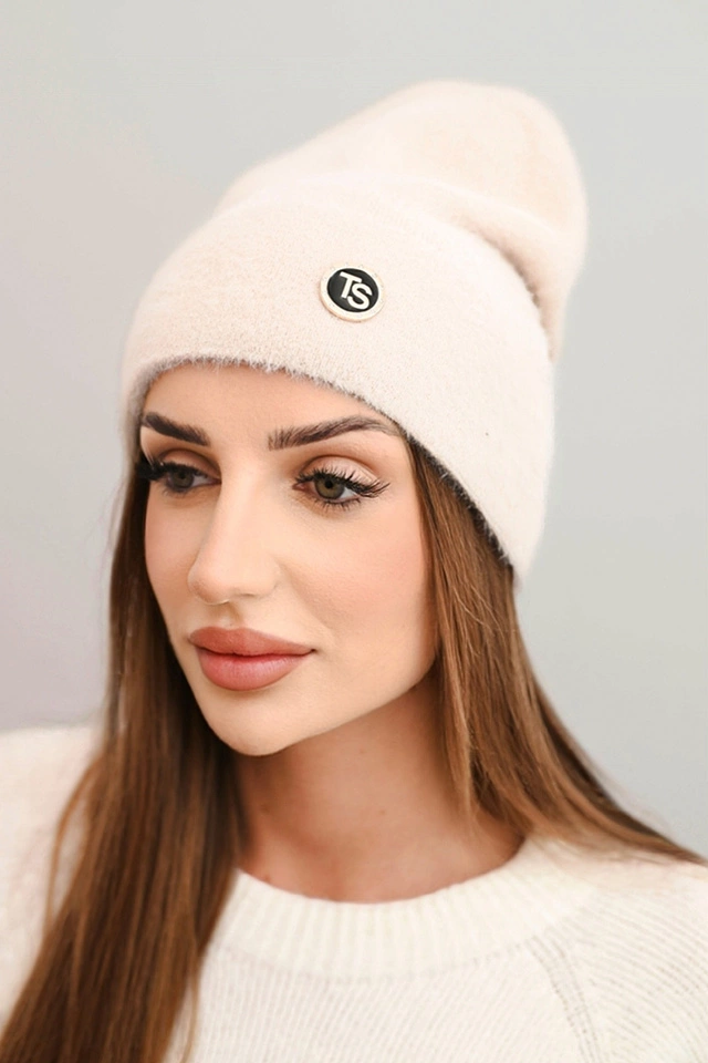 Soft women's alpaca cap with a decorative plate dark beige