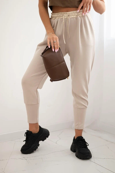 Butter-soft pants with a golden waistband cuff beige