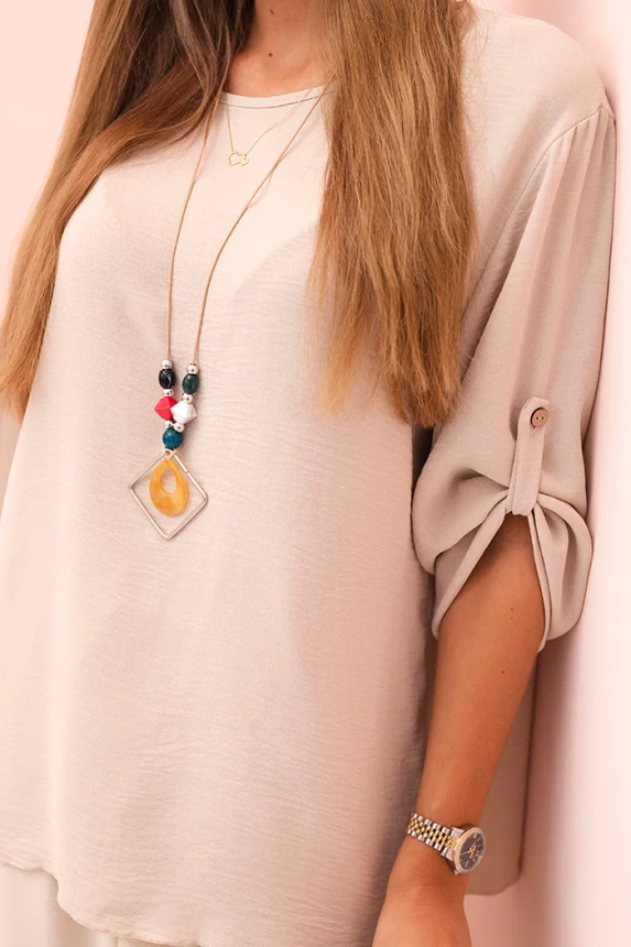 Women's set with a blouse with a necklace and wide pants beige