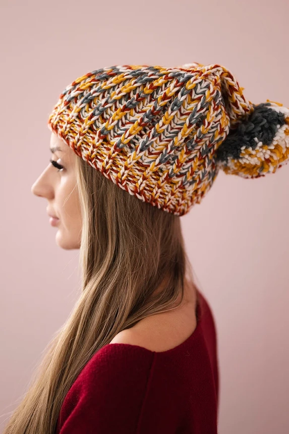 Cap with a pompom Maria K335 mustard
