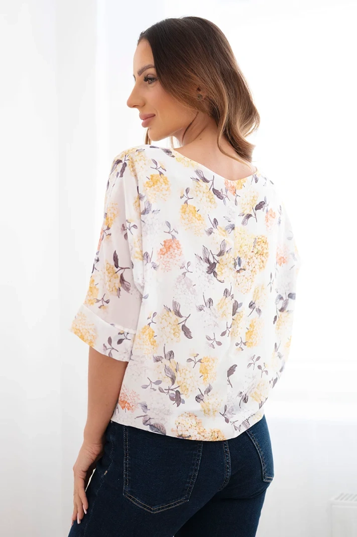 Women's floral blouse with tie at the hem yellow