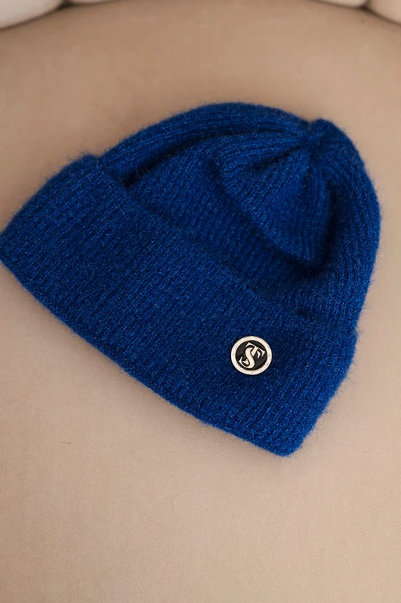 Women's winter fluffy hat with decorative button cornflower blue