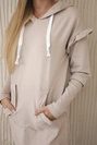 Dress with decorative frills and a hood beige