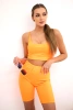 Set with high-waisted pants orange neon