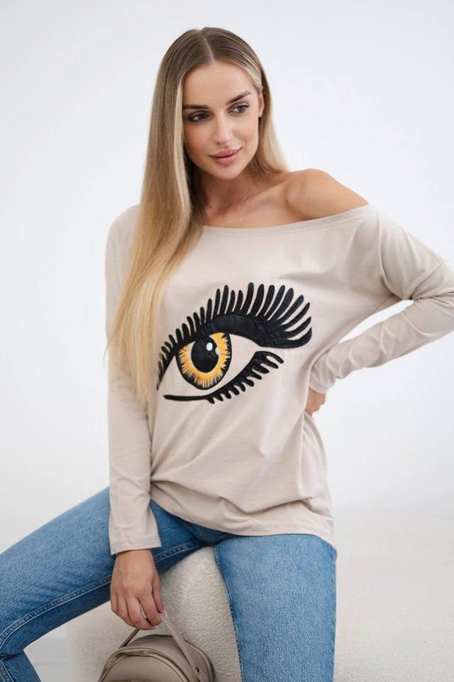 Bluse mit Druck und längerem Rücken beige