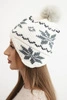 Women's winter wool hat with snowflake pattern and pompom K450 white + graphite