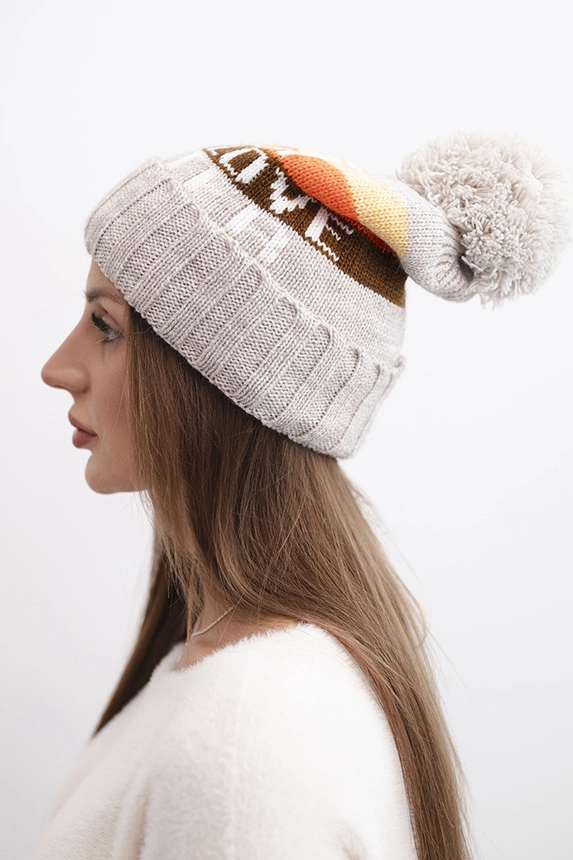 Women's winter hat with wool and a large pompom with inscription K422 beige