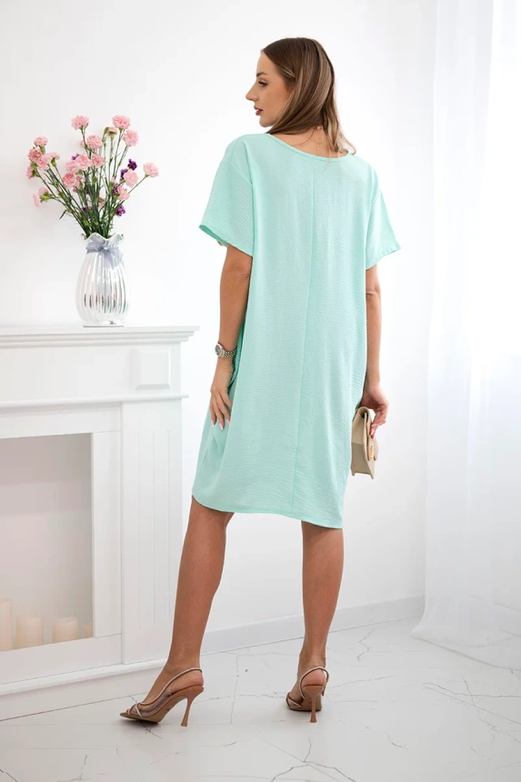 Kleid mit Taschen und Anhänger Helles Mint