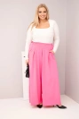 Moteriškos medvilninės kelnės Plus Size su plačiais šonais ir laisvu siluetu šviesiai rožinės