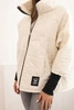 Women's quilted jacket with a short cut and stand-up collar light beige
