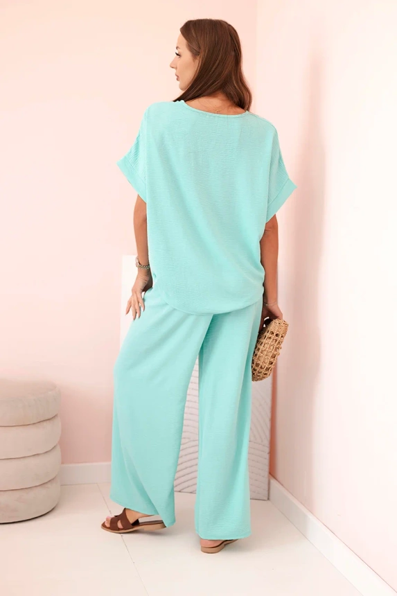Women's viscose set with decorative flower and wide trousers - mint