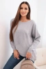Women's sweater with a longer back and embossed star gray