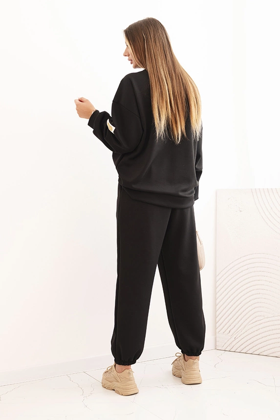 Ladies' butter set with a loose sweatshirt and pants with the word LOVE black