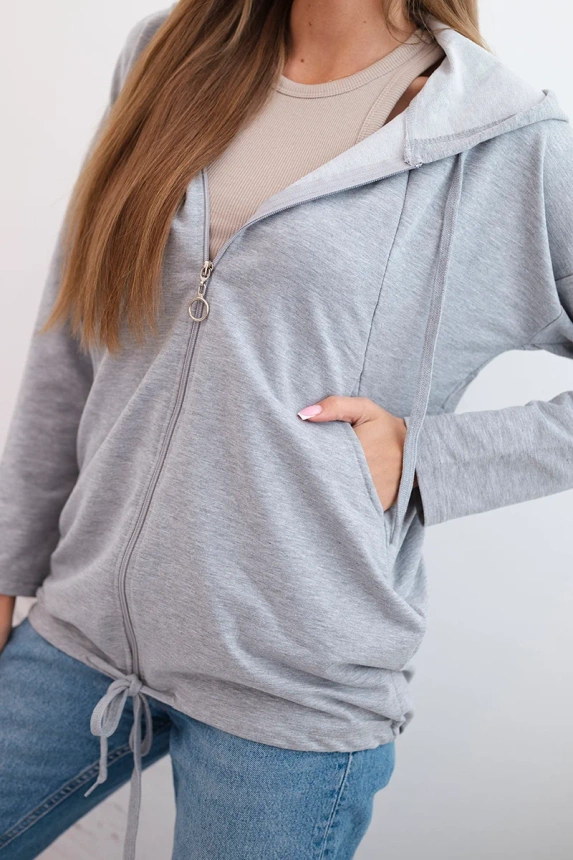 Women's hoodie with a hood and drawstring at the bottom grey