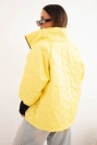 Women's spring quilted jacket with decorative embossing and zipper yellow