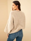 Oversized women's sweater with a round neckline and ribbed hem dark beige
