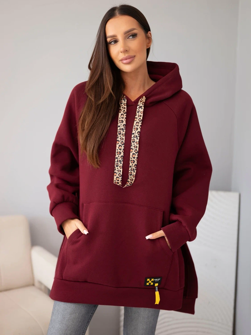 A sweatshirt women's oversize made of cotton with a hood and a pocket burgundy